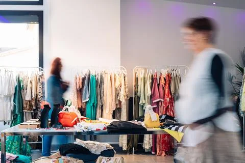 Out of focus movement effect of two customers in a fashion shop. shopping Stock Photos