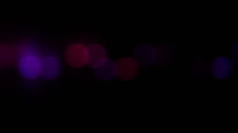 Out of focus moving light at night. Stock Footage 79226587