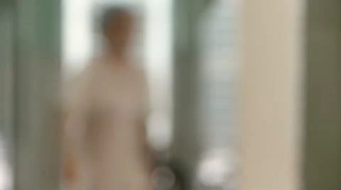 An out of focus Nurse passes by Video stock 41579399