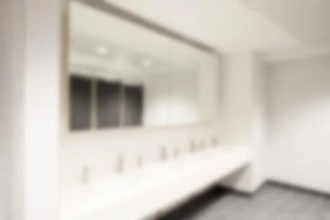 Out of focus or blurred background of office bathroom mirror Stock Photos