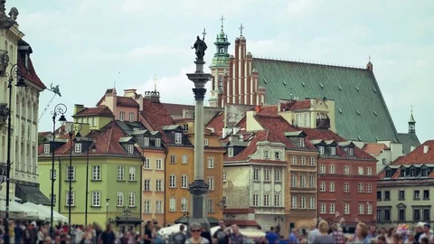 Out of focus scene of people walking on the sidewalk.  Stock Footage 77068488