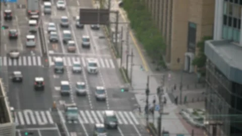 Out of focus shot of Elevated view of Japanese people crossing road intersection Stock Footage 280746269