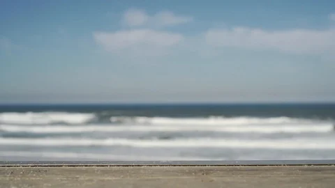 Out of focus shot of sea waves on beach with cloudy sky, Portugal Stock Footage 129065762