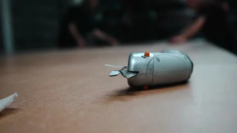 Out of focus shot of workers moving printed fabric Stock Footage 135160632