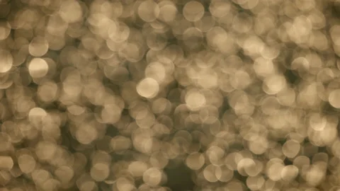 Out of focus sparkling water creates abstract bokeh ball patterns - close up. 4K Stock Footage 234725106