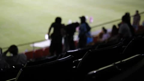 Out-of-Focus Stadium Crowd and Empty Seats with Soft Bokeh Lights Stock-Footage 322007169