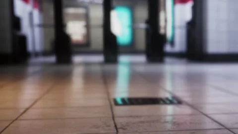Out of Focus Subway Station Platform With Glowing Signs During the Night Hours Stock Footage 348401522