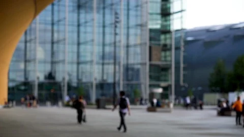 Out of focus time lapse of busy city life, people walking through square. Video stock 117361335