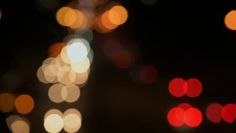 Out of focus traffic lights at night - stock video Stock Footage 236760865