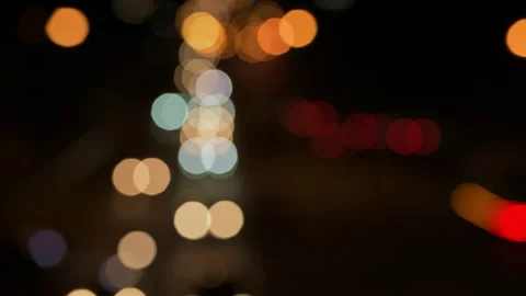 Out of focus traffic lights at night - stock video Stock Footage 236769936