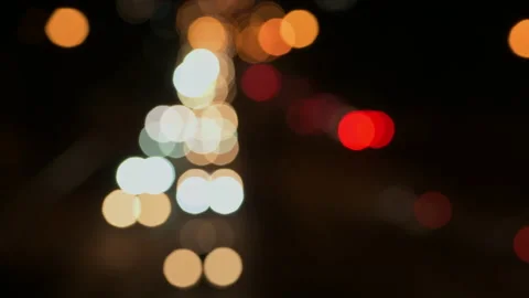 Out of focus traffic lights at night - stock video Stock Footage 236795941