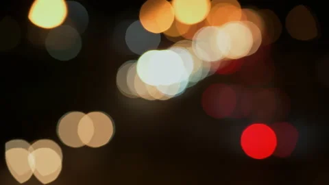 Out of focus traffic lights at night - stock video Stock Footage 236797332