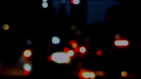 Out-of-focus Traffic. Nighttime Traffic Bokeh. Traffic Bokeh Background Stock Footage 321788027