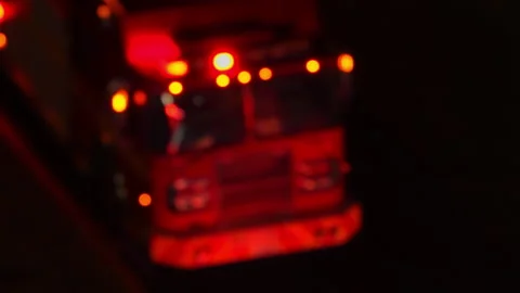Out of focus view of fire emergency truck on accident scene at night. First.. Stock Footage 346839809