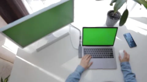 Out of focus. view of hands typing on laptop keyboard Stock Footage 136051716