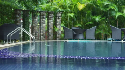 Out of focus view of the pool. Weather's beauty unveiled in Asian tropics Video stock 269973049
