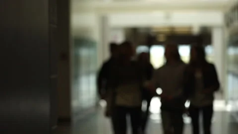 Out of focus view of students walking in school hallway Stock Footage 147339222