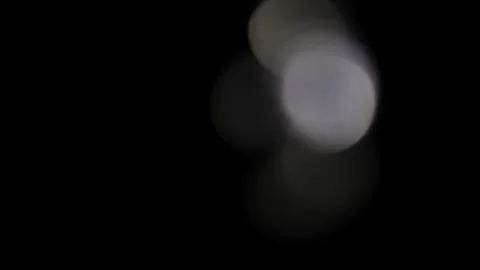 Out Of Focus White Bokeh Light Leaks On Black Background Abstract Stock Footage 328228817