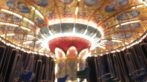 Out of focuse whirling empty carousel with blinking lights 스톡 동영상 62625695