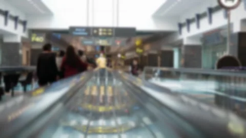 Out of focusing blurred view on escalator walkway interior inside airport d.. Stock Footage 275668071