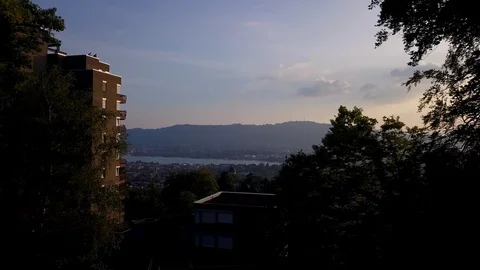 Out Of The Forest Sunset Drone Shot Over Zurich Stock Footage 91623024