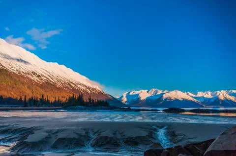 The out-going tide in Turnagain Arm on a sunny, winter day Stock Photos