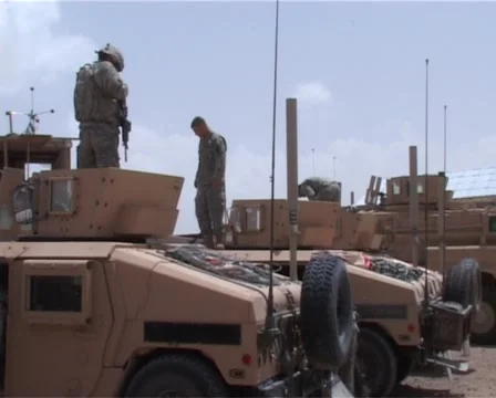 Out of the Humvee with machine gun Stock Footage 987803