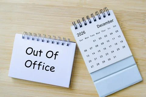 Out of office notification text on notepad with December calendar. Christma.. Stock Photos
