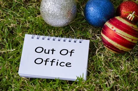 Out of Office Top view of Out of Office text on with Christmas decoration b.. Photos