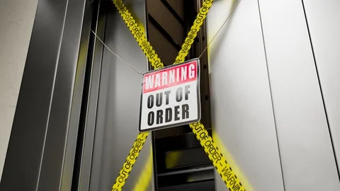 Out of order warning sign in front of a broken elevator door opened. 4KHD Stock Footage 127289945