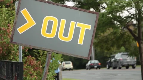Out word caption text horizontal gray yellow crooked out sign exit entrance Stock Footage 249755215