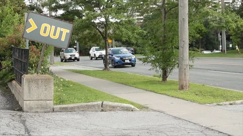 Out word caption text horizontal gray yellow crooked out sign exit entrance Stock Footage 249755238