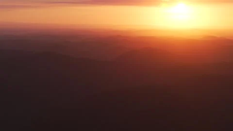 Outback vibrant orange sunset sunrise mountain layers aerial drone horizon Stock Footage 287587747