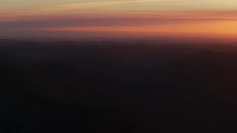Outback vibrant orange sunset sunrise mountain layers aerial drone horizon Stock Footage 287587871