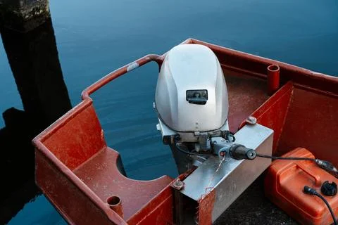 Outboard Engine Mounted On Small Red Harbor Boat Stock Photos