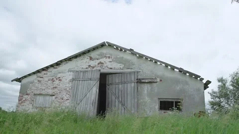 Outdated abandoned village building with broken roof Stock Footage 135960065
