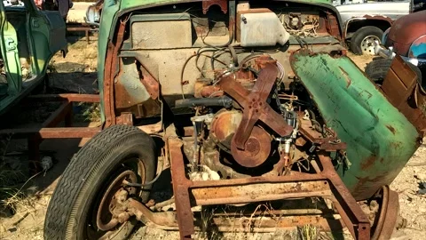 Outdated American disassembled green car. Scrap car footage. Stock Footage 253132444