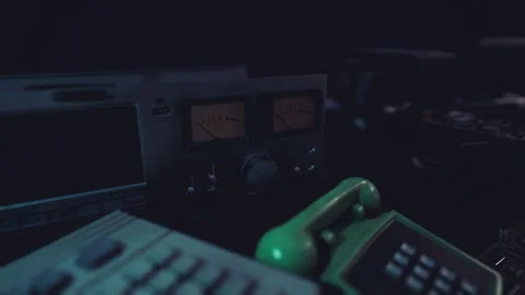 Outdated communication devices arranged on a table in dim lighting Stock Footage 293437143