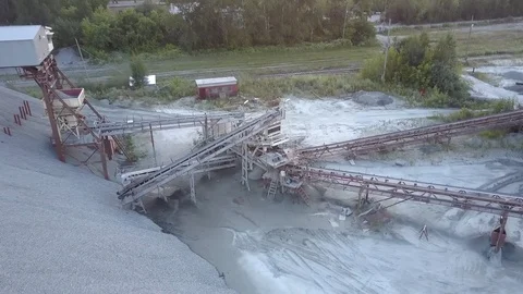 Outdated mining sector construction at grey rubble barrow Stock Footage 114426199