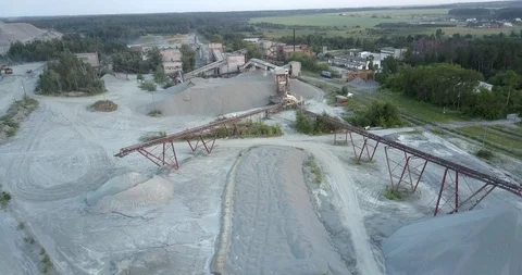 Outdated mining sector constructions against green forest Stock Footage 114955207