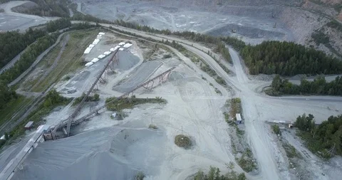 Outdated mining sector with white bags clusters and machines Stock Footage 115525929