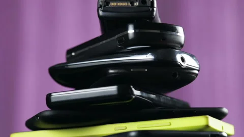 Outdated models of mobile phones and smartphones Stock Footage 88174915