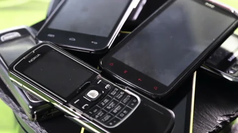 Outdated models of mobile phones and smartphones Stock Footage 89029116