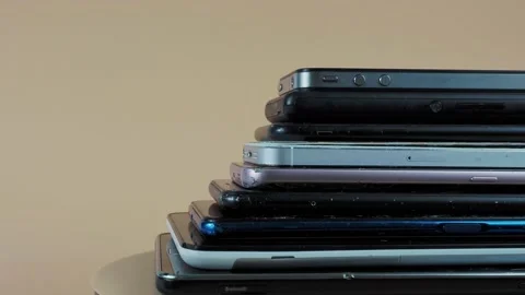 Outdated models of mobile phones and smartphones. Rotation of old smartphones. Stock Footage 202091695