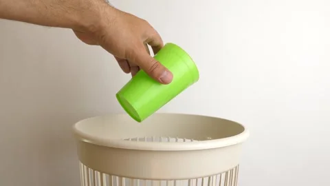 Outdated plastic cups are recycled and thrown into the trash. The concept of dis 스톡 동영상 245980903