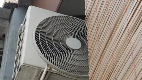Outdoor Air Conditioner Condenser Unit Mounted on Building Exterior Stock Footage 340880259