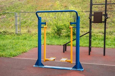 Outdoor air walker exercise machine in a public fitness area. Stepper equip.. Stock Photos