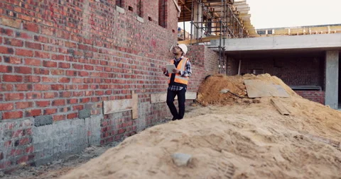 Outdoor, architecture and man with tablet at construction site, civil engineer Stock Footage 336225581
