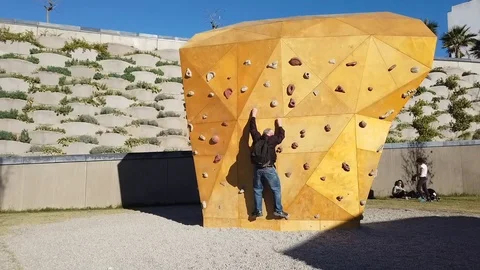Outdoor Artificial Climbing Wall Stock Footage 100587377