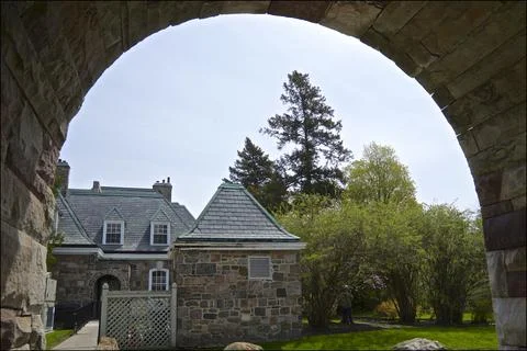 Outdoor backyard in springtime through the arch of the building Stock Photos